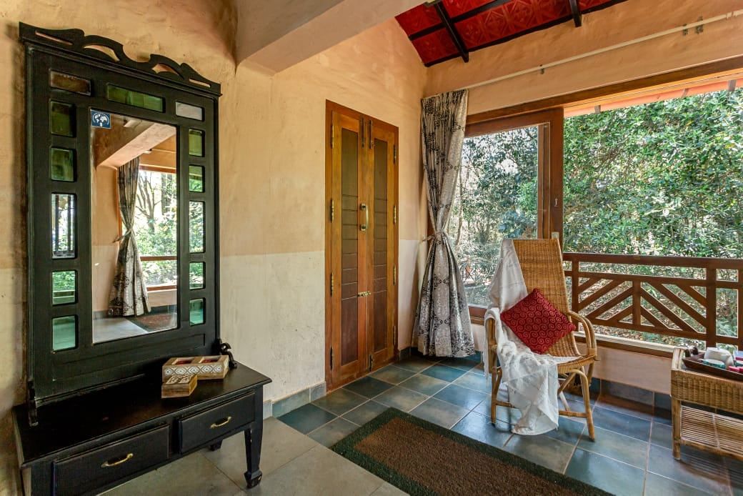 A wicker chair on a veranda at Shanti Makaan, Rishikesh